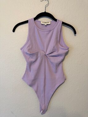 The Giving Movement Twist-Front Ribbed Bodysuit in Lilac